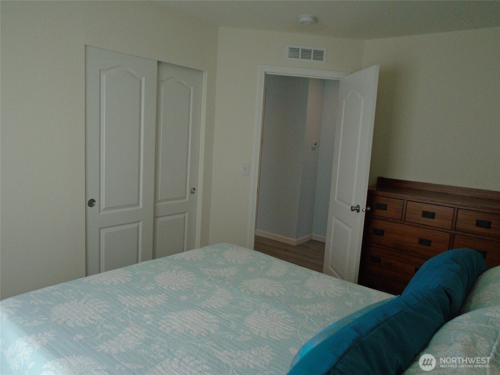 894 North Iris Avenue Sequim, WA 98382 - Photo 17 of 38 a bedroom with a bed and a dresser