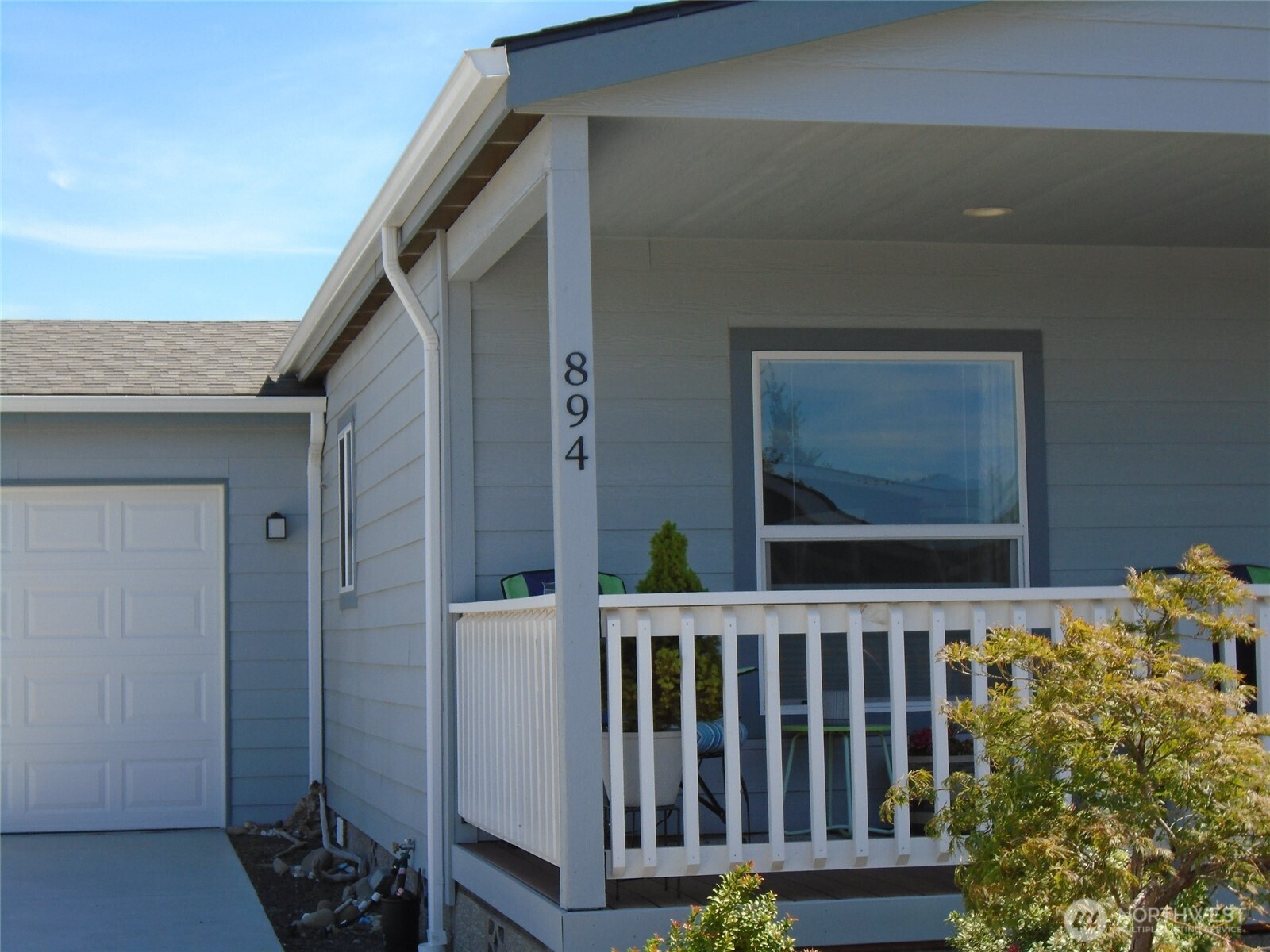894 North Iris Avenue Sequim, WA 98382 - Photo 2 of 38 a view of a small yard from a balcony