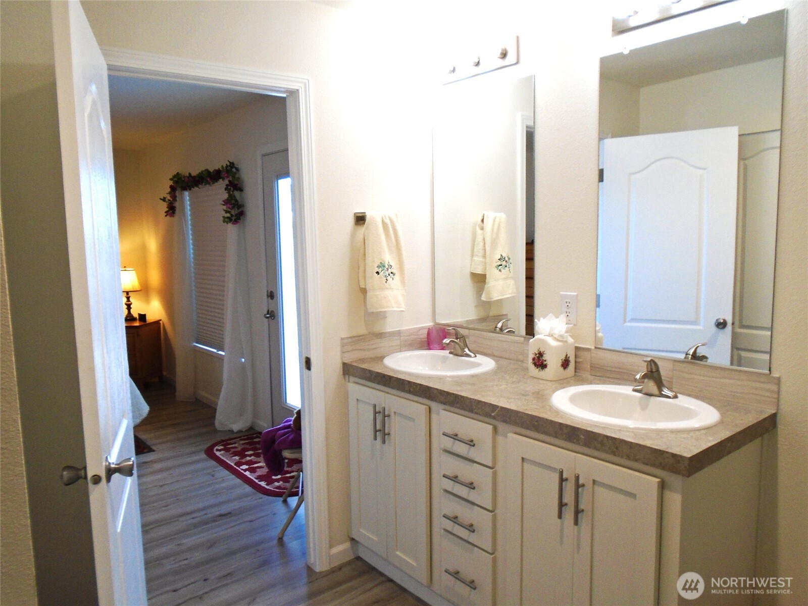 894 North Iris Avenue Sequim, WA 98382 - Photo 22 of 38 a bathroom with a double vanity sink and mirror