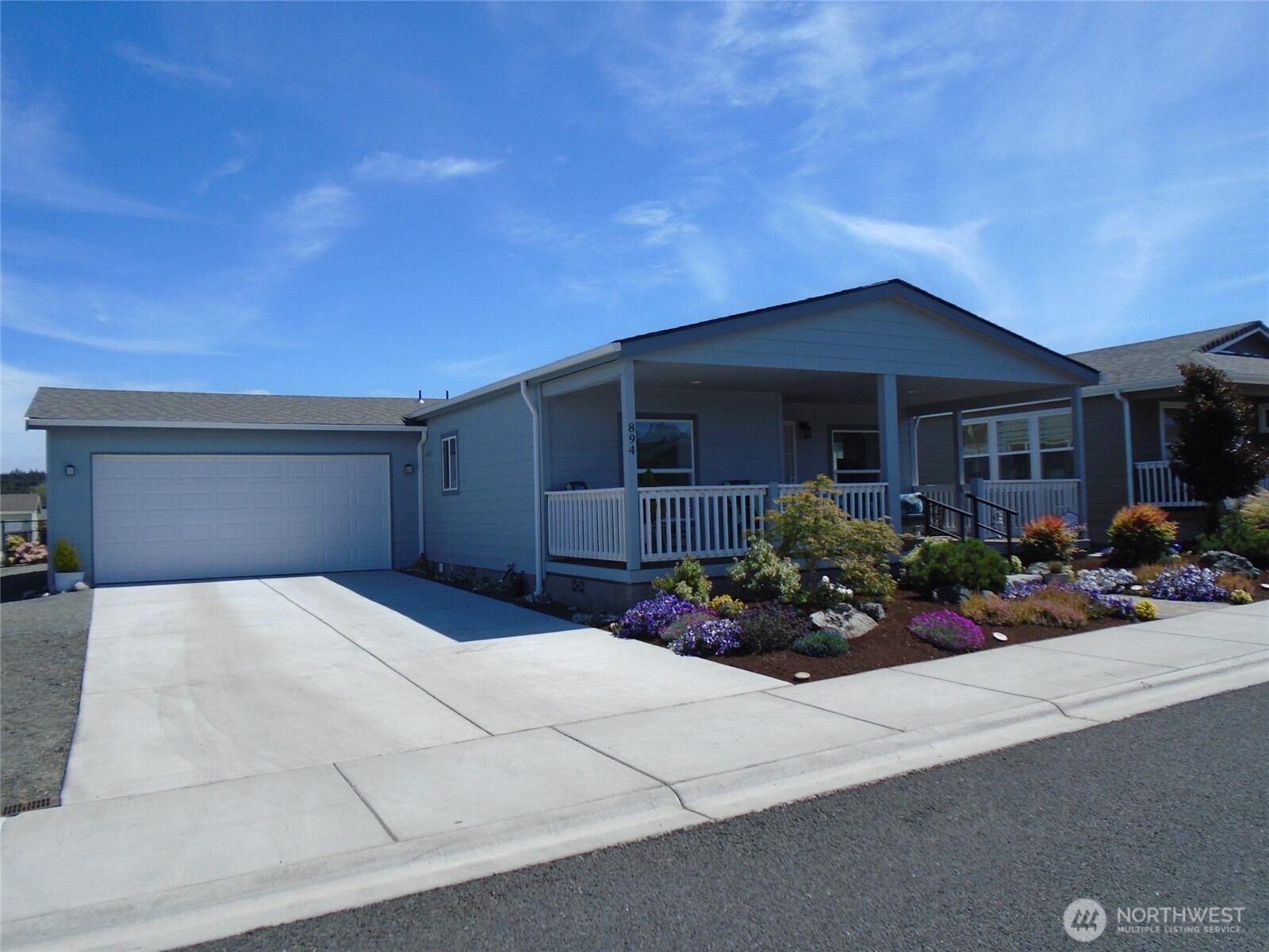 894 North Iris Avenue Sequim, WA 98382 - Photo 26 of 38 a front view of a house with a yard