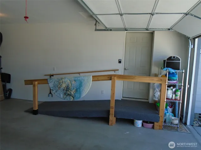 a bedroom with a bunk bed and a rug