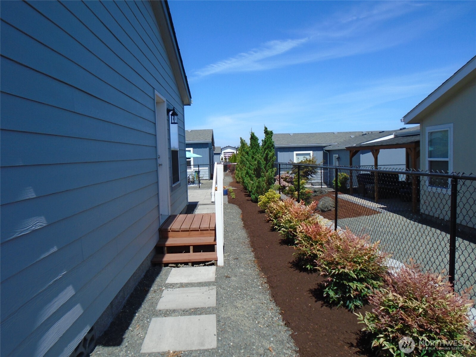 894 North Iris Avenue Sequim, WA 98382 - Photo 29 of 38 a view of a house with a patio