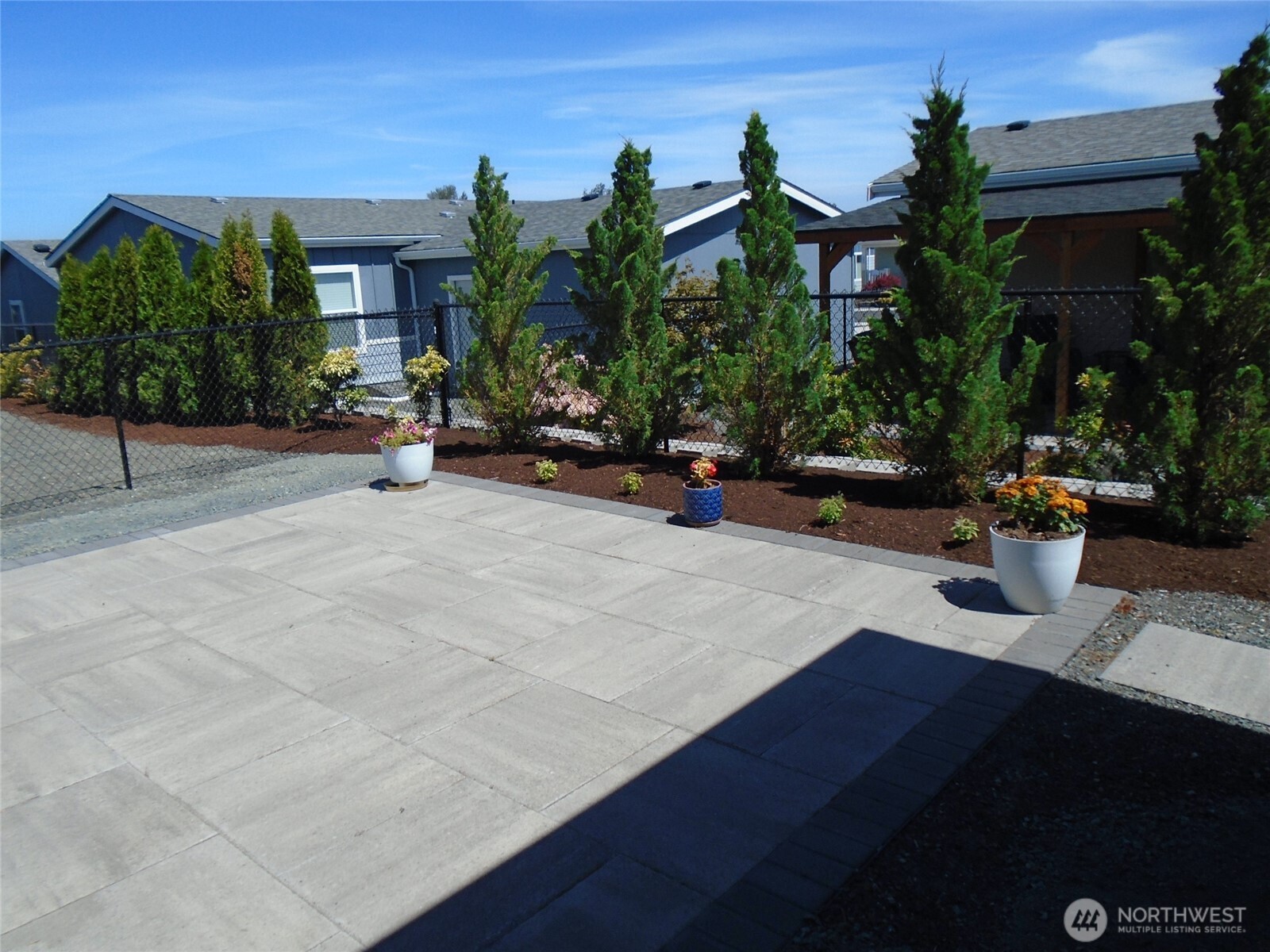 894 North Iris Avenue Sequim, WA 98382 - Photo 32 of 38 a view of a patio with table and chairs and potted plants