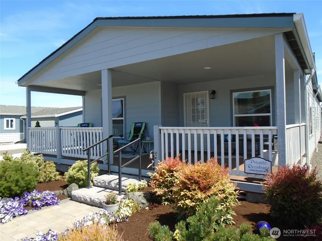 a view of a chair and table in the balcony