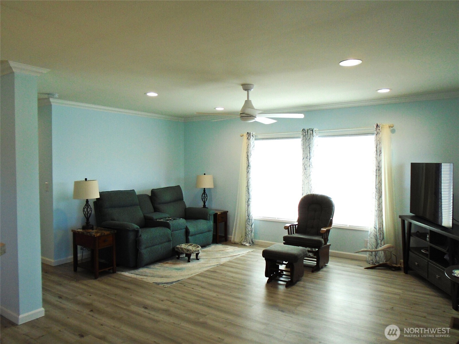 894 North Iris Avenue Sequim, WA 98382 - Photo 6 of 38 a living room with furniture and a flat screen tv