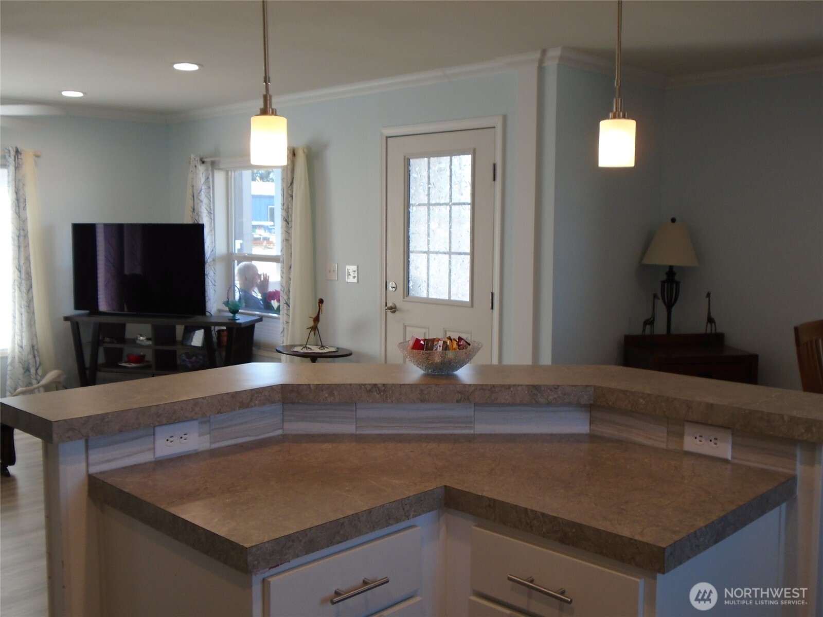 894 North Iris Avenue Sequim, WA 98382 - Photo 7 of 38 a kitchen with a sink a counter top space and a window