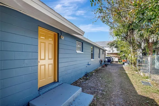 a view of a house with a backyard