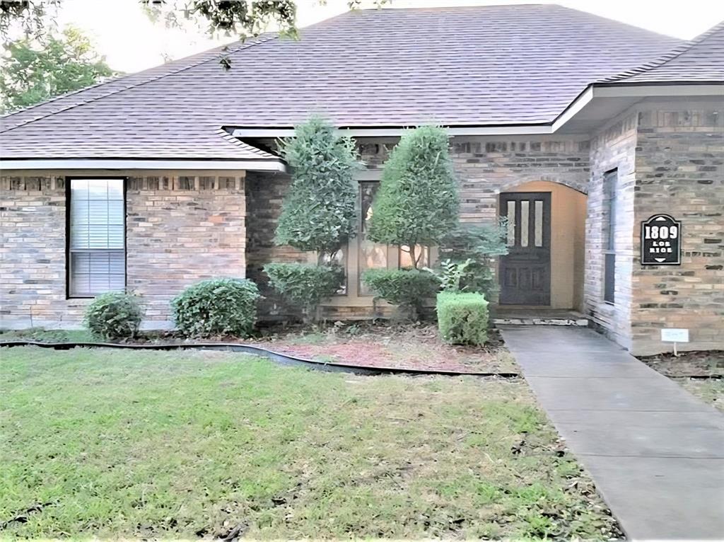 1809 Los Rios Boulevard Plano, TX 75074 - Photo 1 of 1 a front view of a house with garden