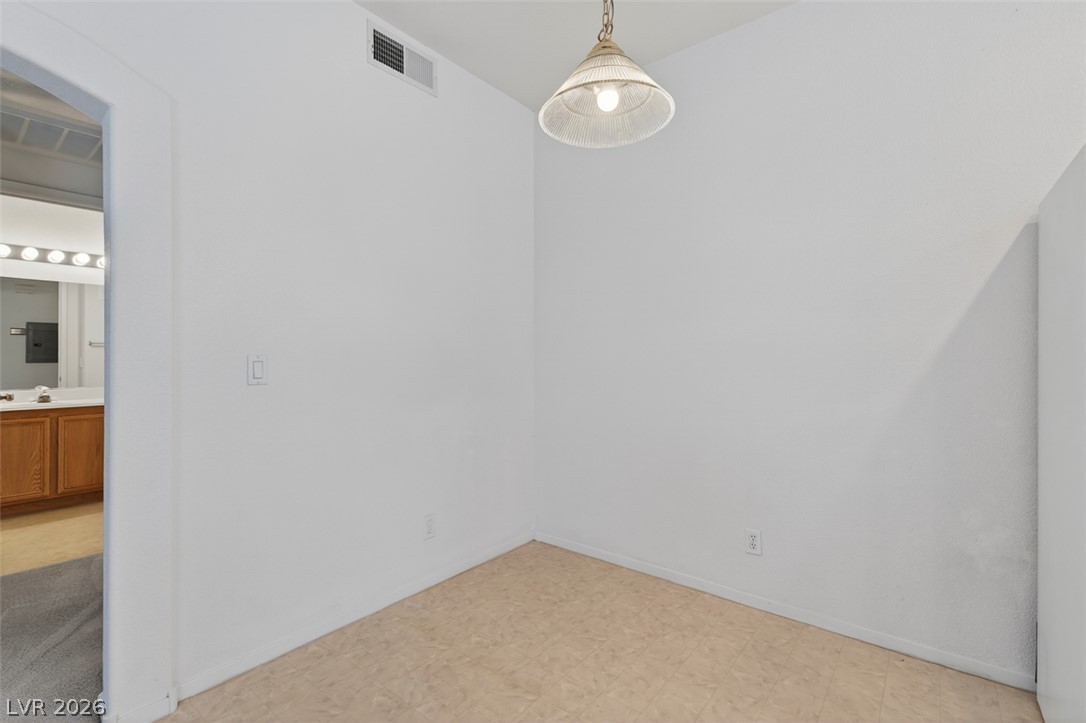 2201 Ramsgate Drive, Unit 1011 Henderson, NV 89074 - Photo 15 of 40 A well-lit, compact dining area featuring practical flooring and a simple overhead light fixture.