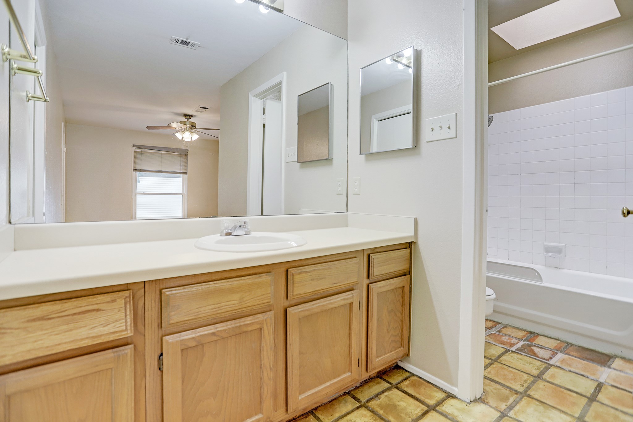 305 Avondale Street, Unit B Houston, TX 77006 - Photo 6 of 12 a bathroom with a sink and a mirror