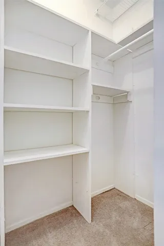 a view of an empty walk in closet