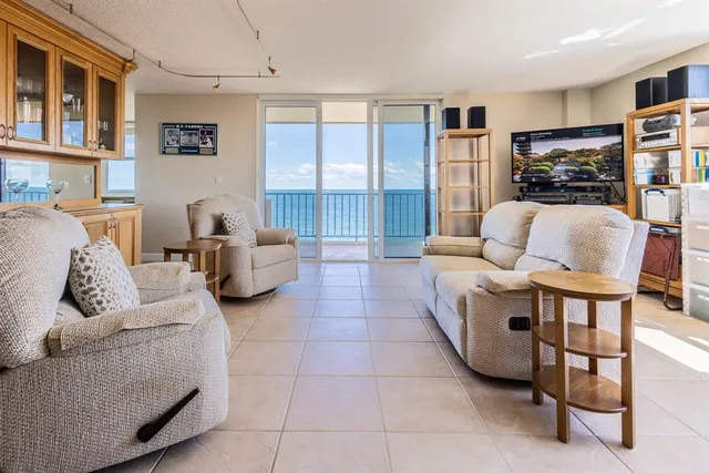 a view of a dining room with furniture and a window