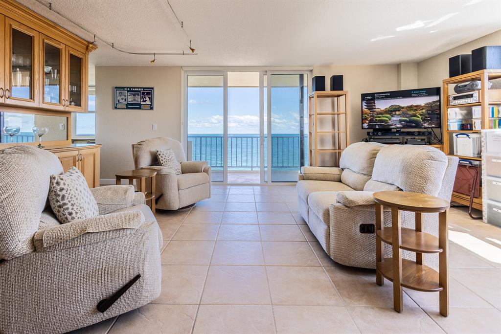 2000 South Ocean Boulevard, Unit 10E Lauderdale-by-the-Sea, FL 33062 - Photo 14 of 86 a living room with furniture and a fireplace