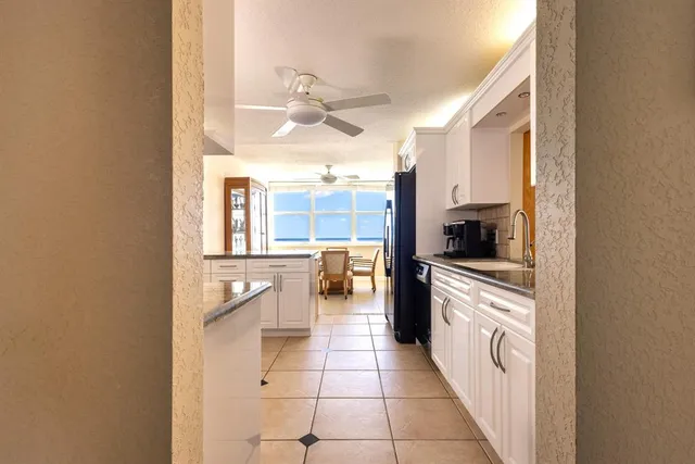 a bathroom with a toilet sink vanity and mirror