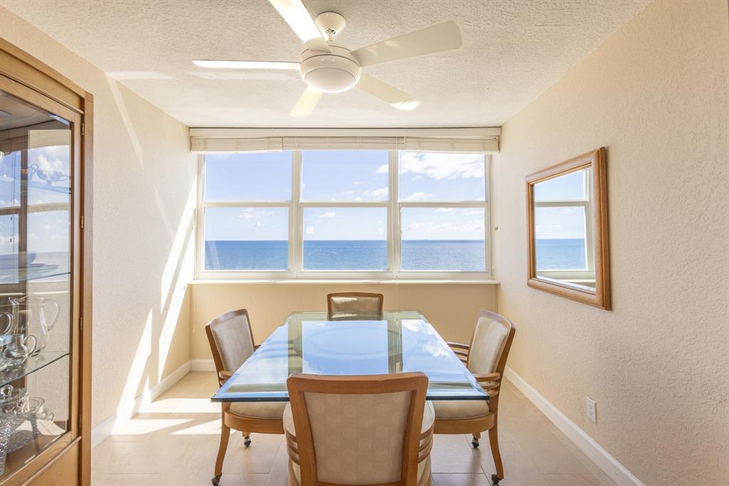 2000 South Ocean Boulevard, Unit 10E Lauderdale-by-the-Sea, FL 33062 - Photo 23 of 86 a view of a dining room with furniture and a window