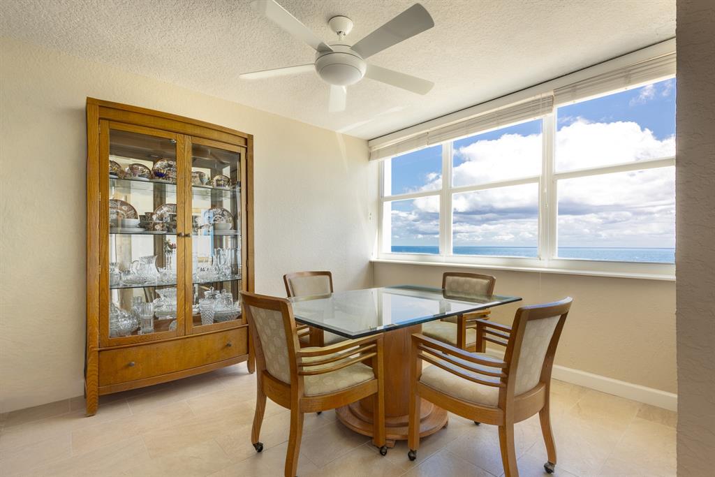 2000 South Ocean Boulevard, Unit 10E Lauderdale-by-the-Sea, FL 33062 - Photo 24 of 86 a dining room with furniture and a window