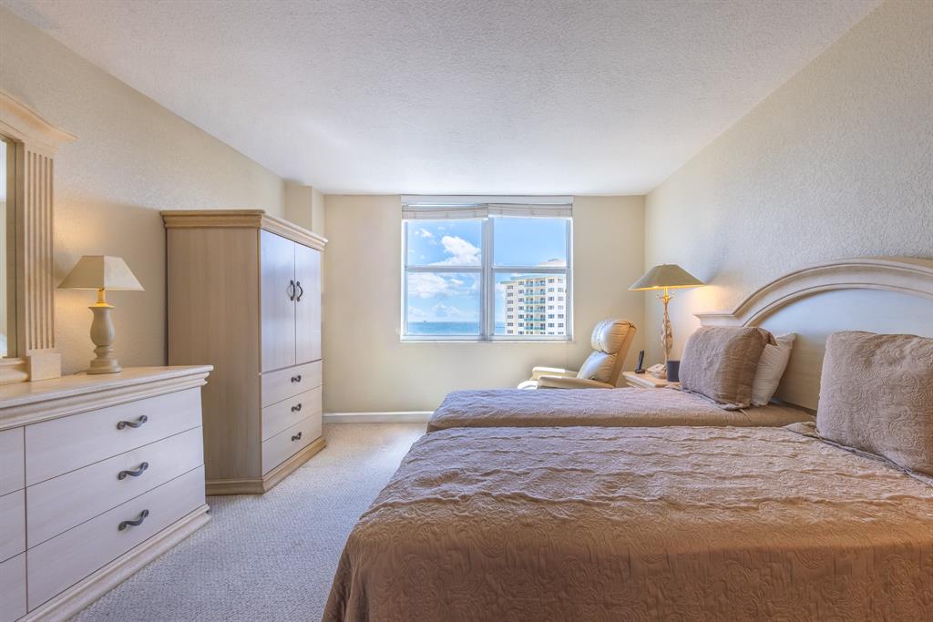 2000 South Ocean Boulevard, Unit 10E Lauderdale-by-the-Sea, FL 33062 - Photo 31 of 86 a bedroom with a bed and a dresser
