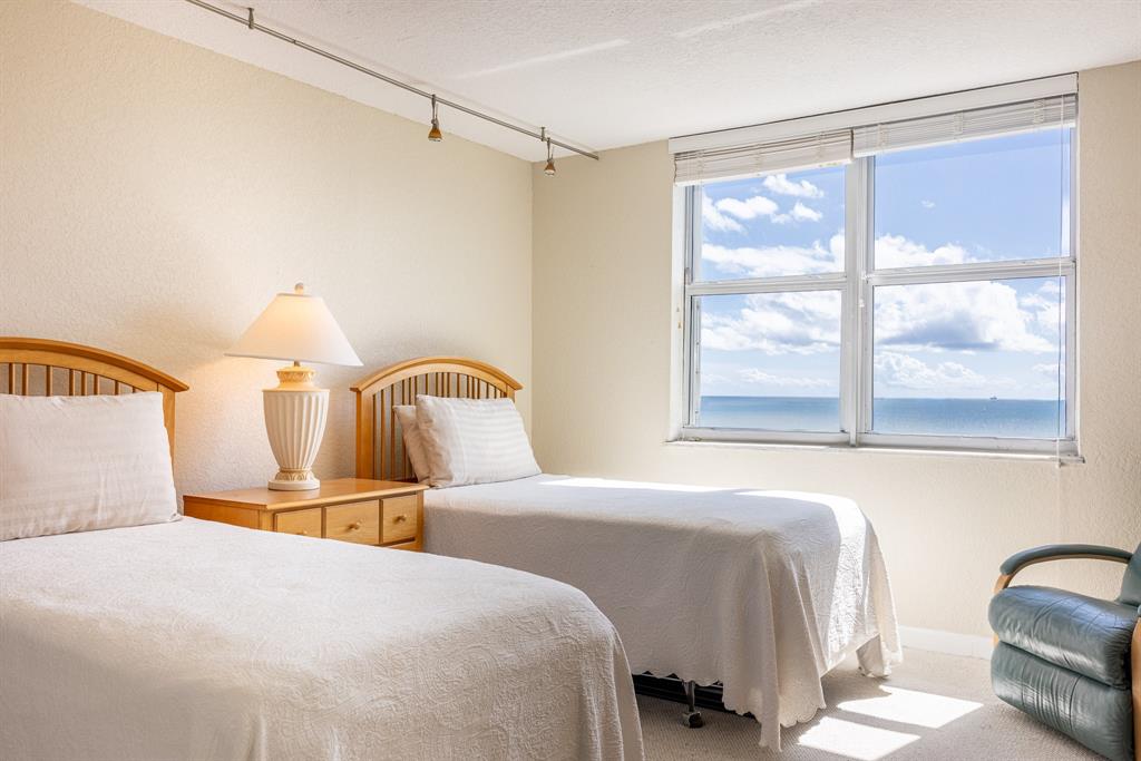 2000 South Ocean Boulevard, Unit 10E Lauderdale-by-the-Sea, FL 33062 - Photo 38 of 86 a bedroom with a bed and a large window