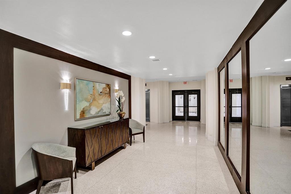 2000 South Ocean Boulevard, Unit 10E Lauderdale-by-the-Sea, FL 33062 - Photo 66 of 86 a view of a hallway with wooden floor and furniture