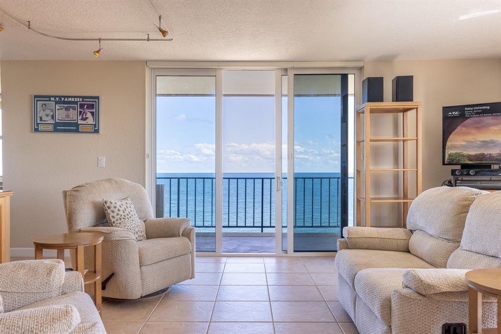 2000 South Ocean Boulevard, Unit 10E Lauderdale-by-the-Sea, FL 33062 - Photo 10 of 86 a living room with furniture and a window
