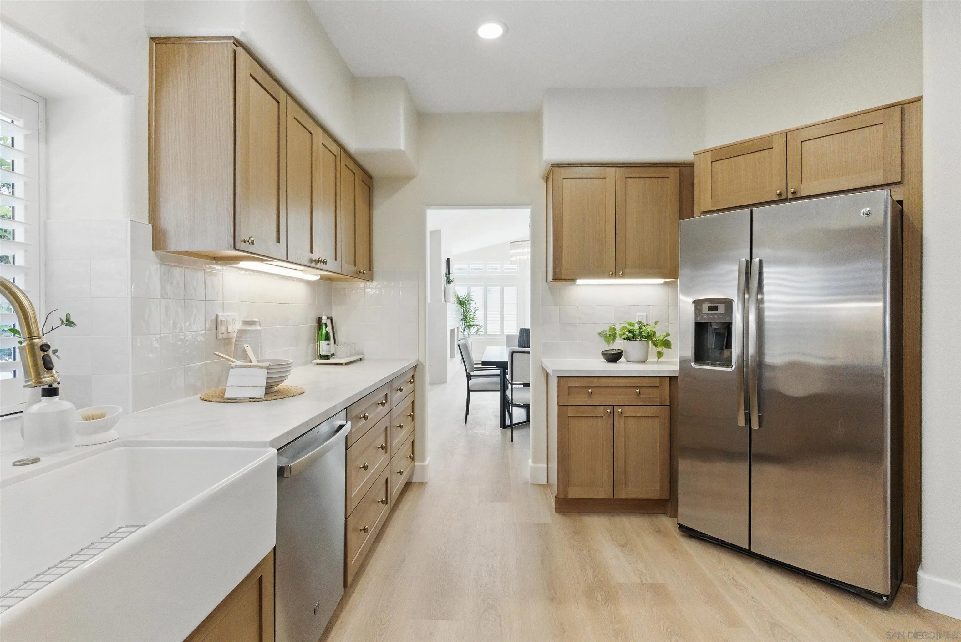 4140 Andros Way Oceanside, CA 92056 - Photo 12 of 41 a kitchen with a sink stainless steel appliances and cabinets