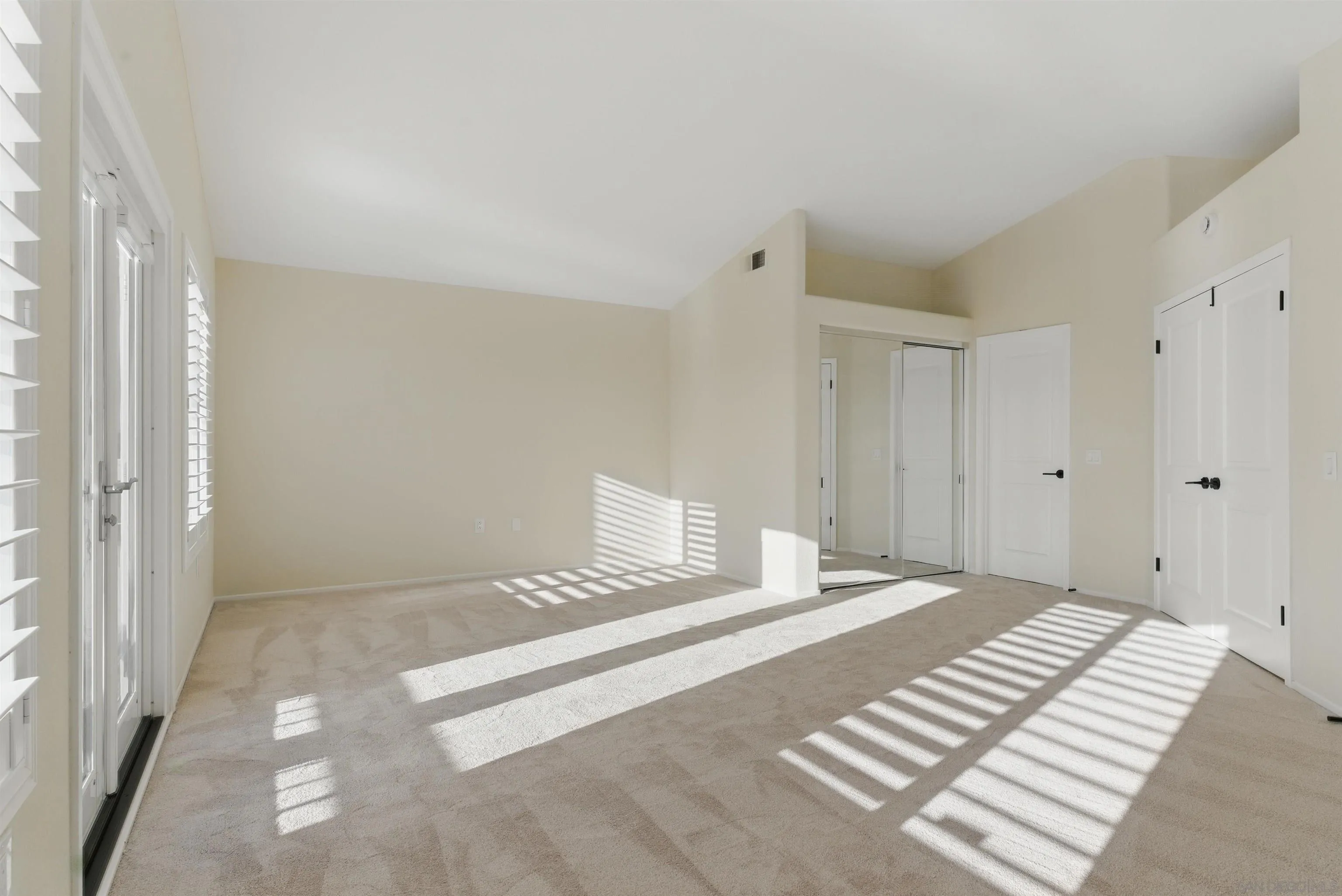 4140 Andros Way Oceanside, CA 92056 - Photo 23 of 41 a bedroom with a bed and a walk in closet