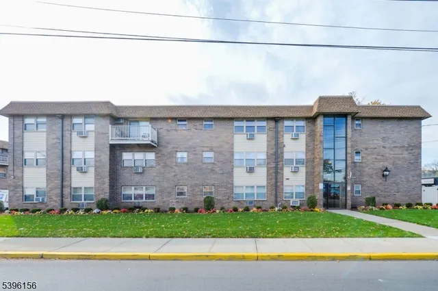 a view of a house with a yard and plants