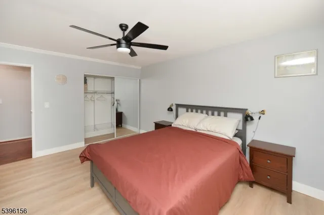 a bedroom with a bed and closet