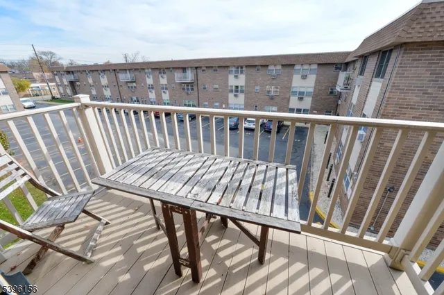 a view of a balcony with wooden floor