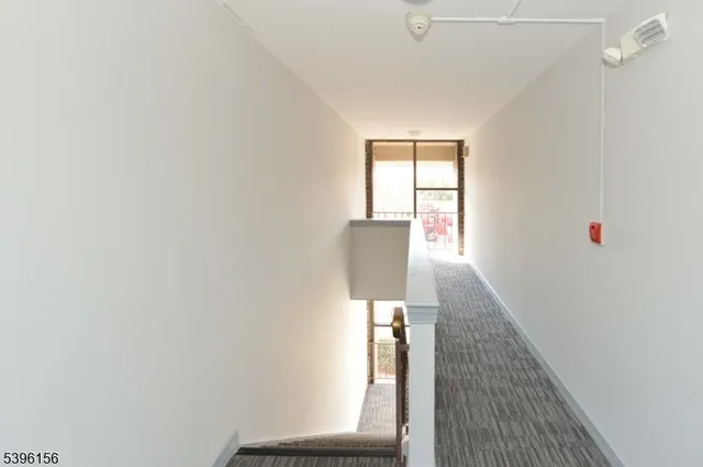 a view of hallway with a window