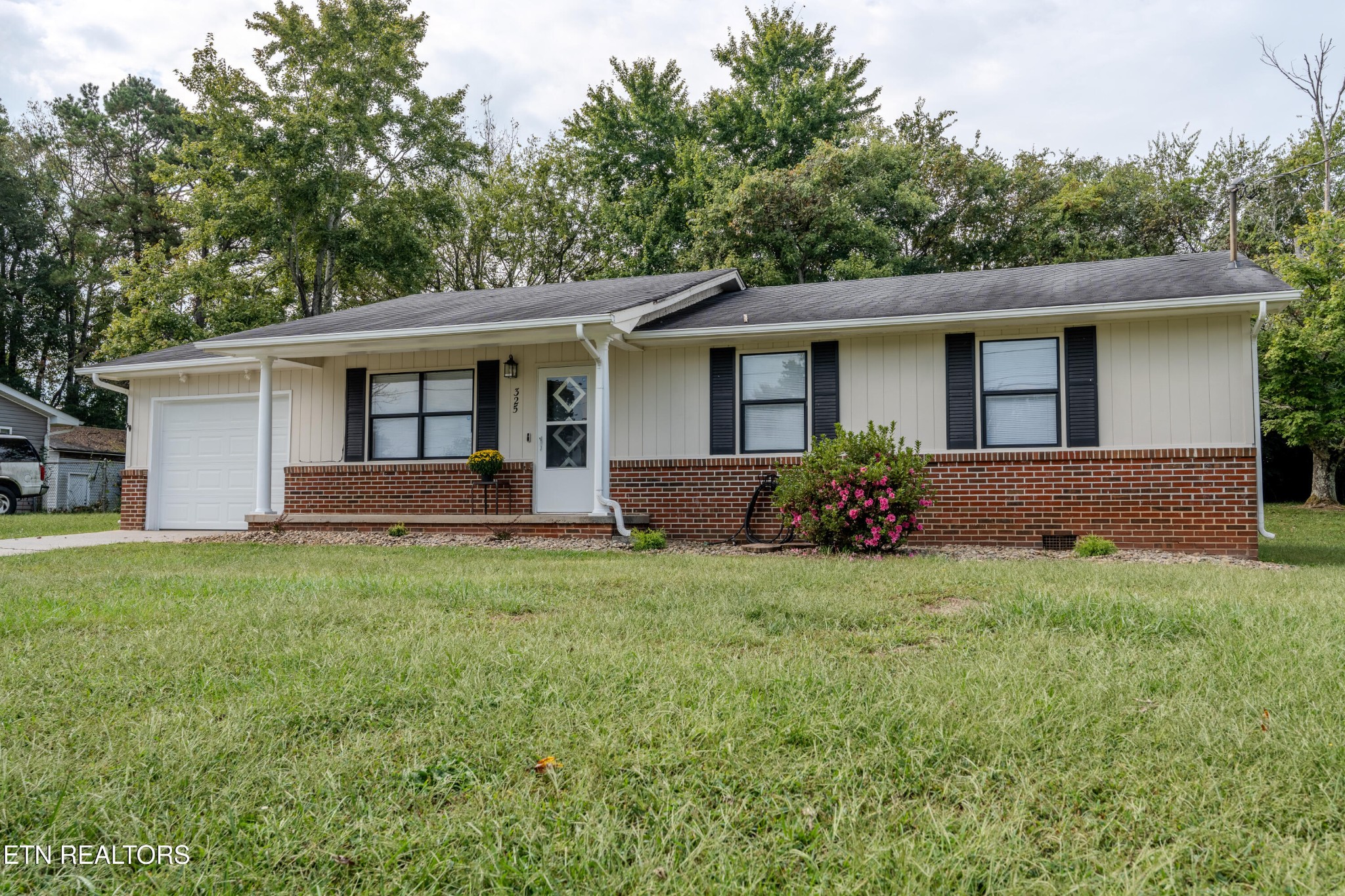 front view of a house with a yard