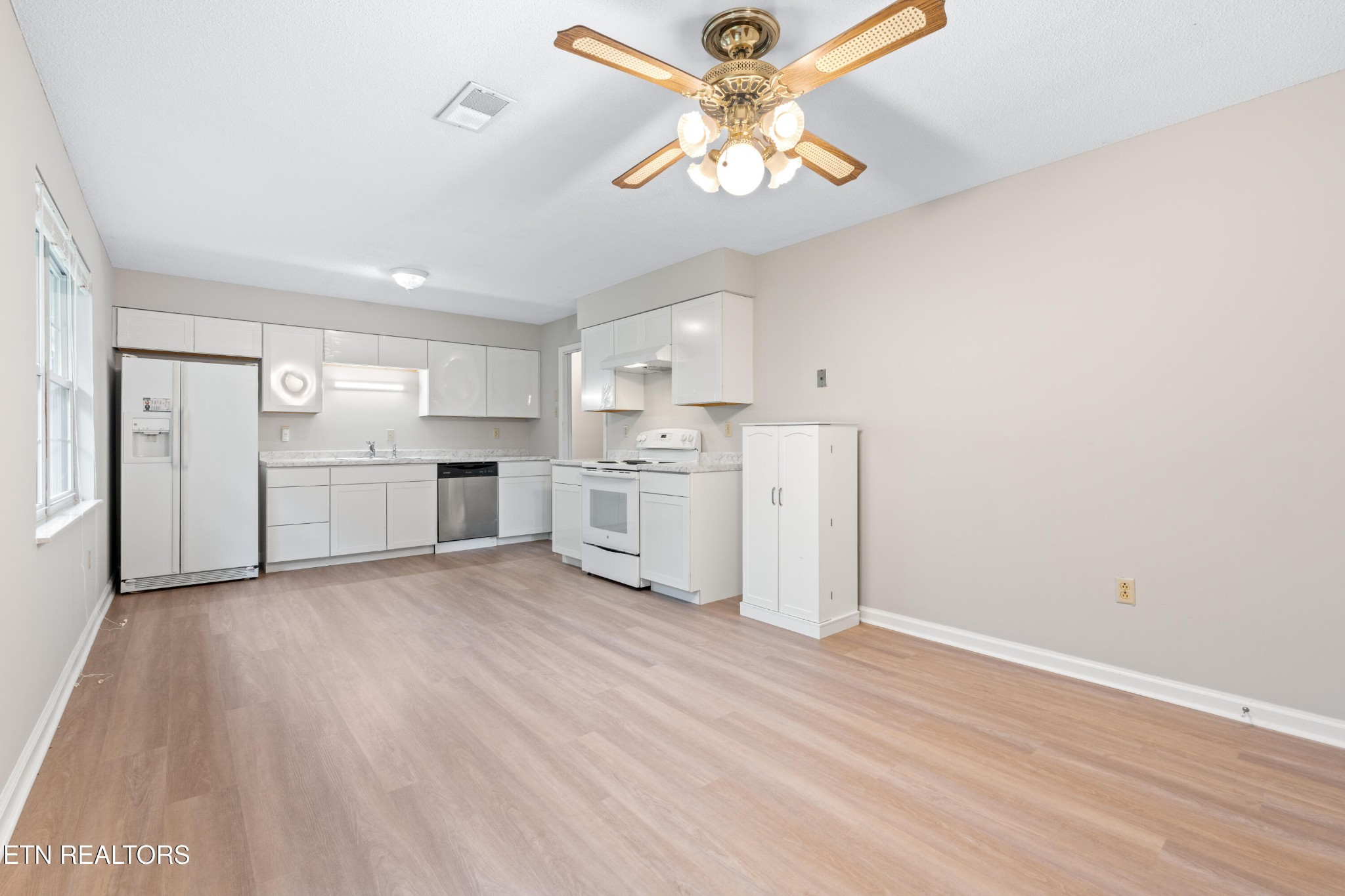 325 Blue Ridge Lane Seymour, TN 37865 - Photo 19 of 27 a view of a kitchen with a dishwasher cabinets and wooden floor