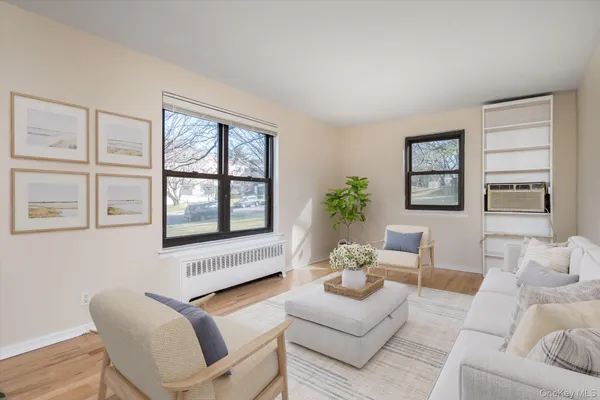 a living room with furniture and windows