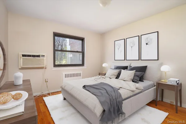 a bedroom with a large bed and a window