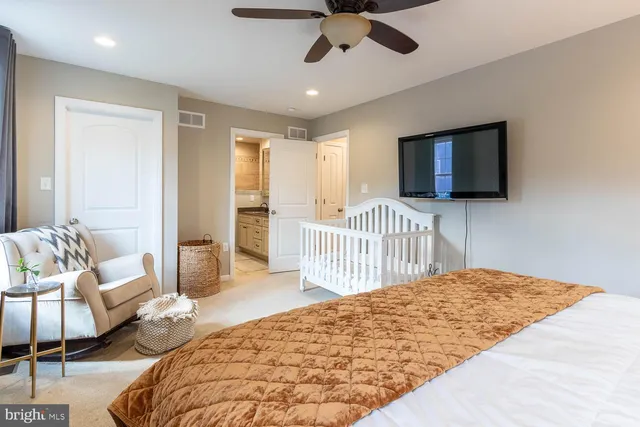 a bedroom with a bed and a couch