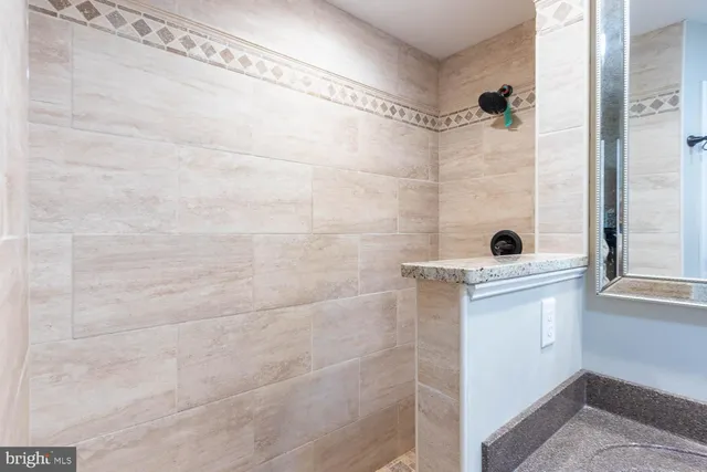 a bathroom with a shower and a sink