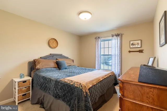 a bedroom with a bed and cabinets