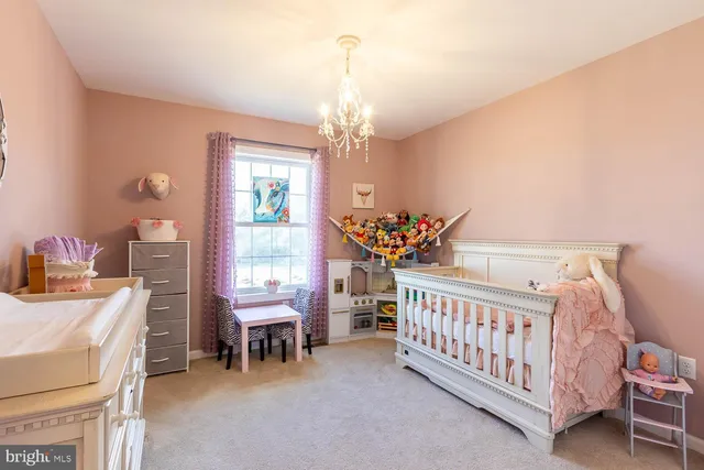 a view of a room with furniture and windows