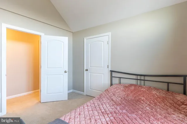 a bedroom with a bed and a shower