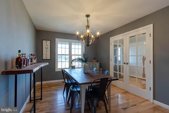 a view of a dining room with furniture and window