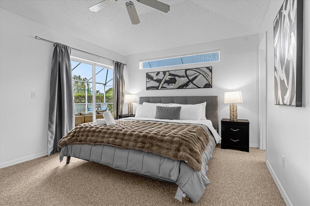 217 Holborn Loop Davenport, FL 33897 - Photo 20 of 23 a bedroom with a bed and window