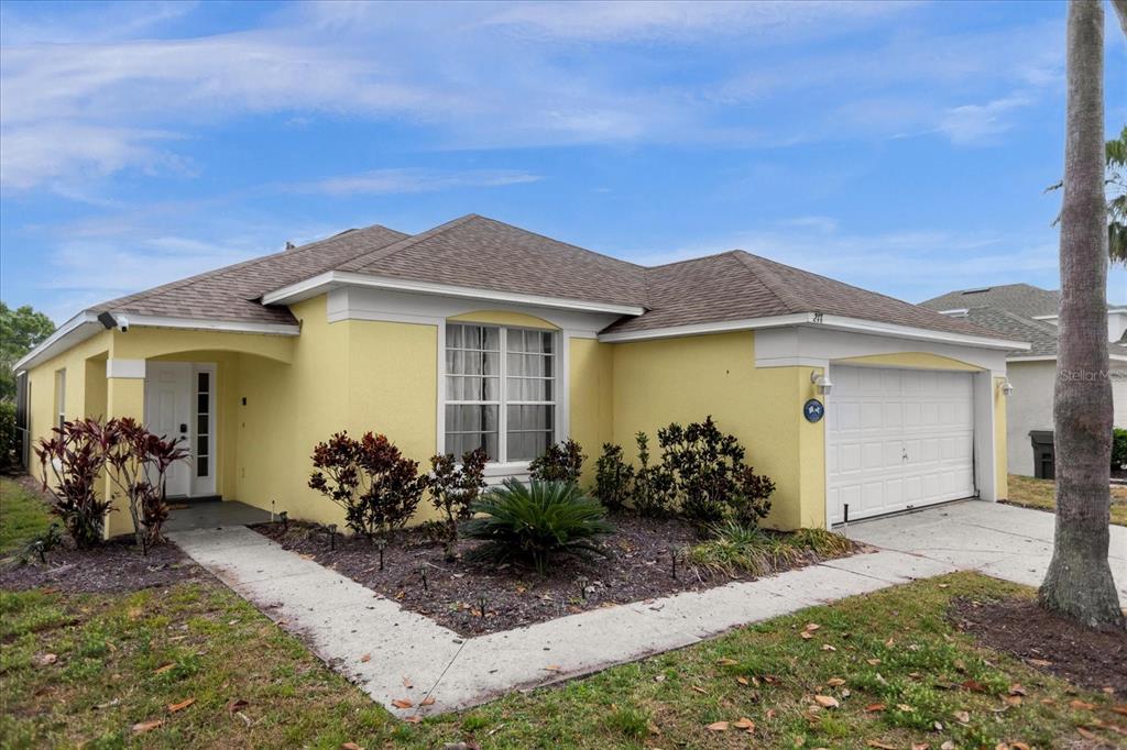 217 Holborn Loop Davenport, FL 33897 - Photo 2 of 23 a front view of a house with a garden