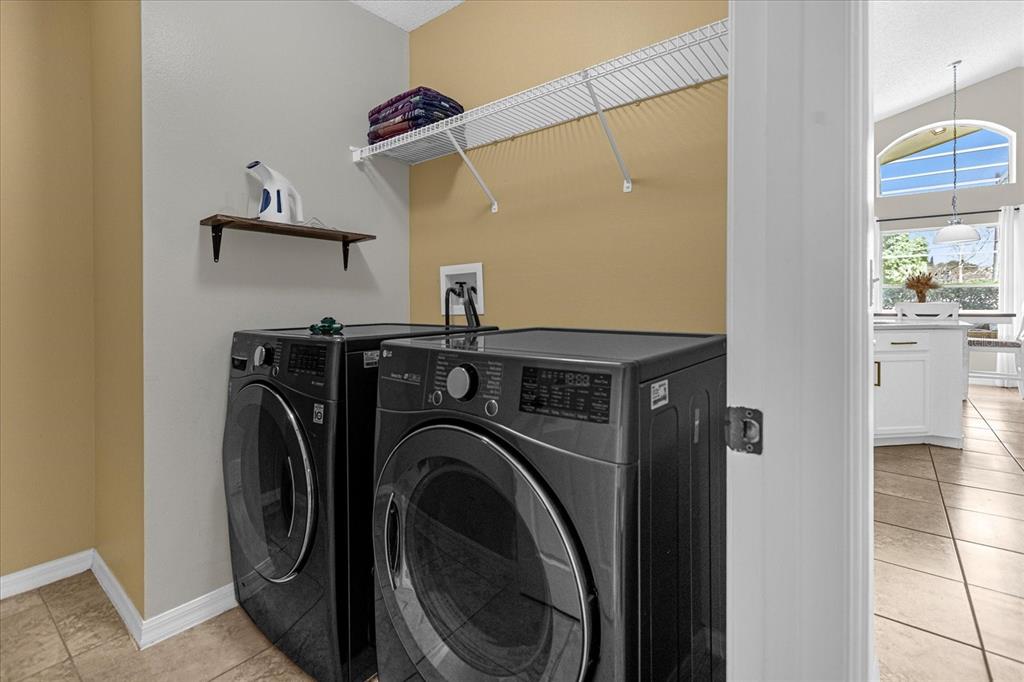 217 Holborn Loop Davenport, FL 33897 - Photo 21 of 23 a utility room with dryer and washer