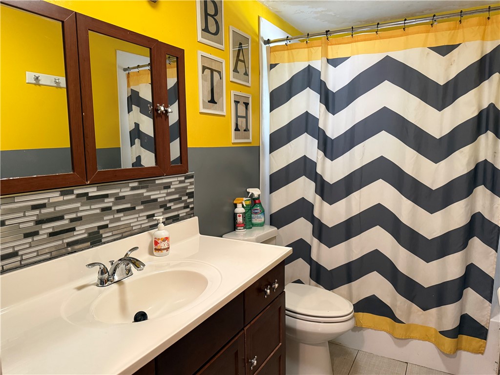 4732 Lehigh Drive Springfield, OH 45503 - Photo 8 of 27 This bathroom features stylish tile work and a convenient vanity with ample storage.