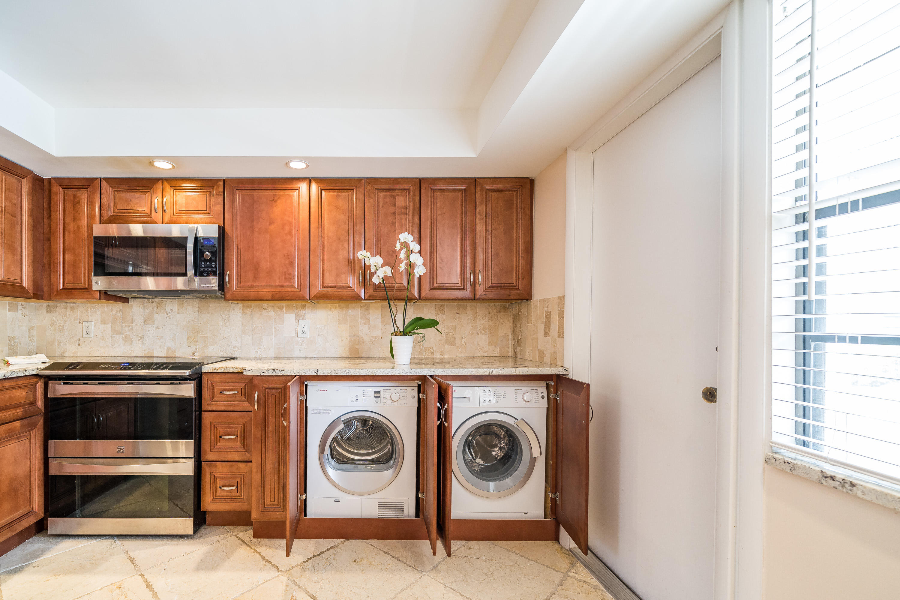 501 Southwest 11th Place, Unit 101 Boca Raton, FL 33432 - Photo 3 of 30 Upgraded Kitchen with washer and dryer