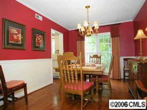 10345 Fairway Ridge Road Charlotte, NC 28277 - Photo 3 of 8 a view of a dining room with furniture window and wooden floor
