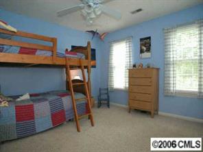 10345 Fairway Ridge Road Charlotte, NC 28277 - Photo 8 of 8 a bedroom with bed and window