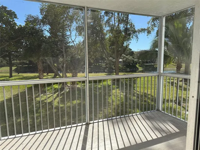 a view of room with window and a ceiling fan