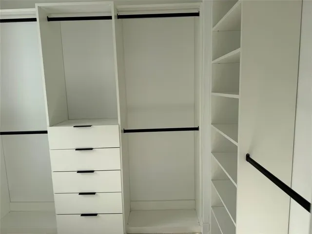 a bathroom with a shower a toilet and sink