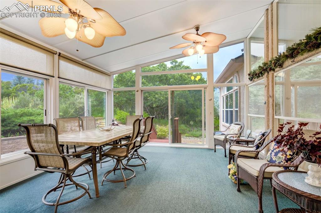 4618 Bethany Court Colorado Springs, CO 80918 - Photo 13 of 50 a dining room with furniture water view and a chandelier